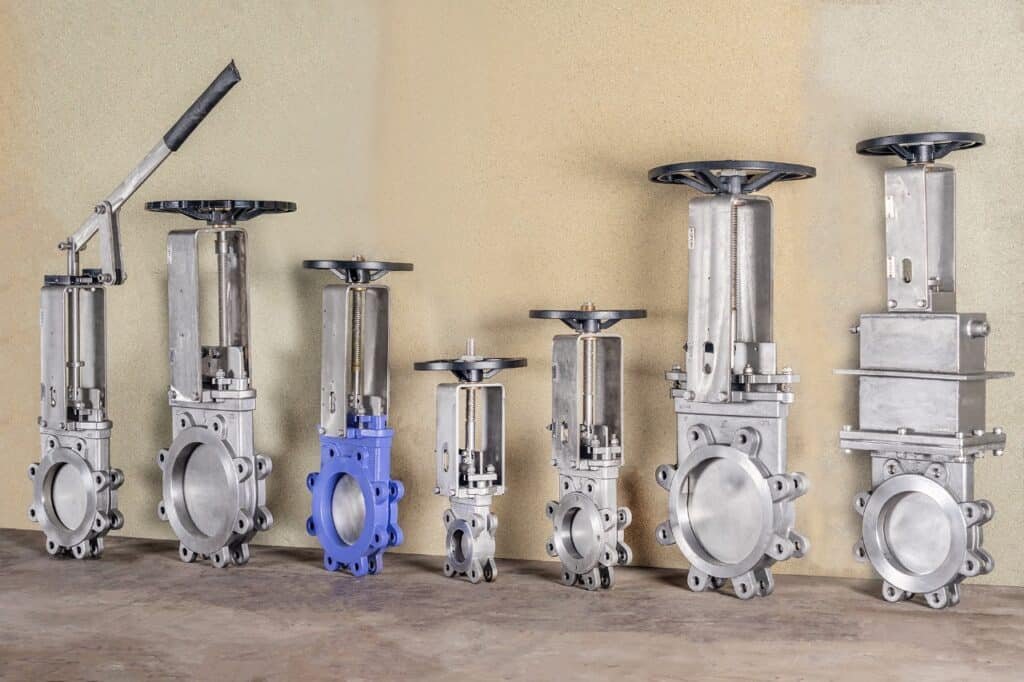 Industrial knife gate valves in multiple sizes and configurations, including handwheel and lever-operated models, designed for slurry, wastewater, mining, chemical, and process industries.