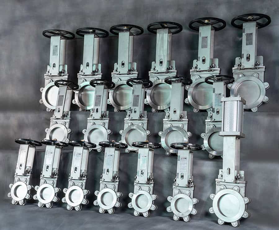 Collection of stainless steel manual and pneumatic knife gate valves in multiple sizes for industrial flow control and shut-off applications.
